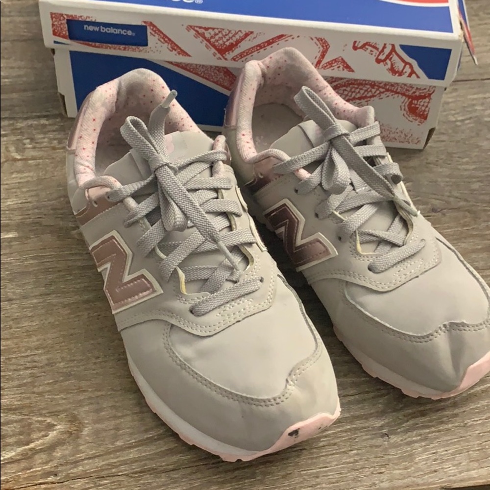 Tan and pink new balance sneaker